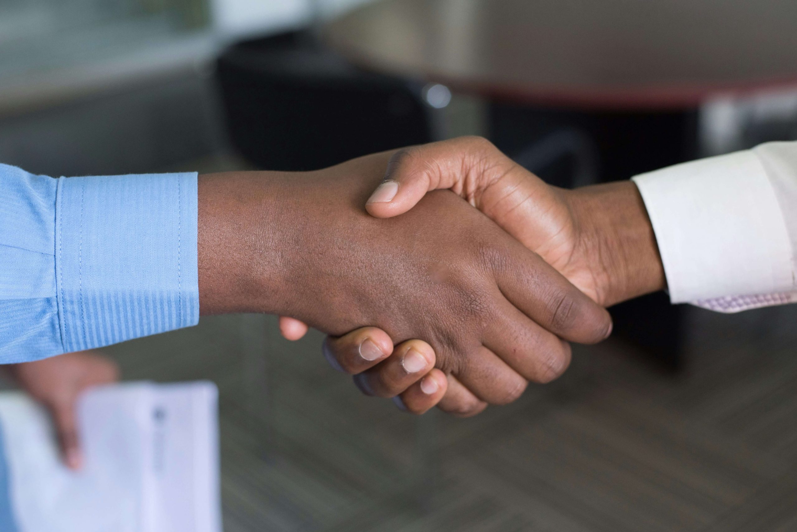Business partnership handshake